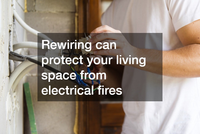 electrician rewiring a wall panel